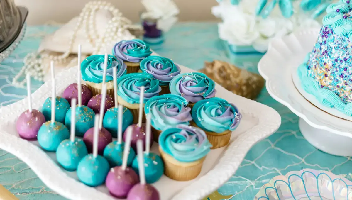 Prizes for Baby Shower Games: Rewards for Fun Times in 2024 2 Colourful cupcakes and cake pops at a baby shower